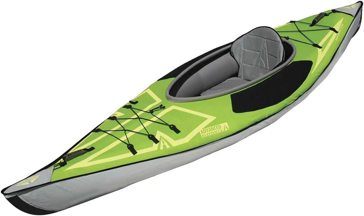 Advanced Elements AdvancedFrame Ultralite inflatable kayak in yellow and grey, shown next to a portable solar battery and camping setup.