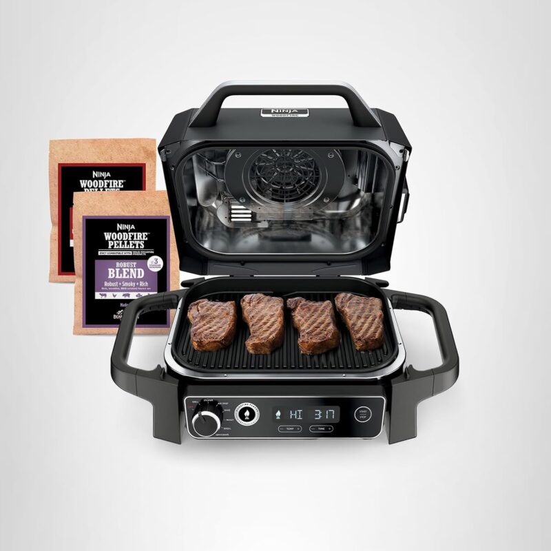 Ninja Woodfire Outdoor Grill OG701 7-in-1 electric BBQ and smoker with woodfire technology and digital control panel.
